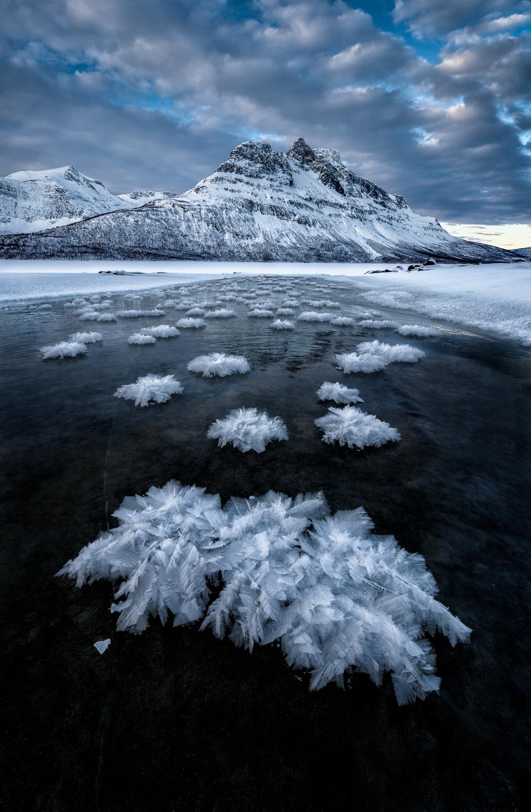 Ice feathers on a frozen river.