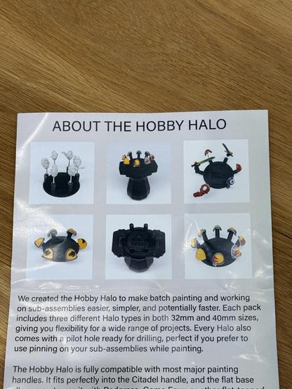 Image features a printed flyer titled "ABOUT THE HOBBY HALO." It includes six images of various Hobby Halo models designed for batch painting and sub-assembly work. The text explains the benefits and features of the Hobby Halo.