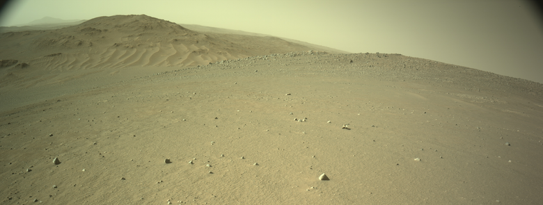 A Martian landscape of dunes and hills.