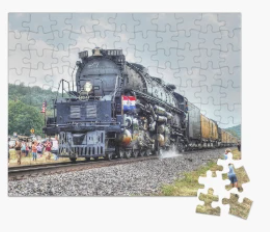 A huge steam engine train making its way through town with the townspeople watching in awe. All of this on a jigsaw puzzle. 