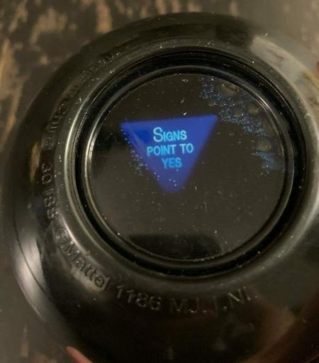 Photo of a Magic Eight Ball, with the message: “Signs Point To Yes”