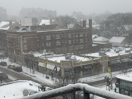 Daytime scene of city during snowstorm 