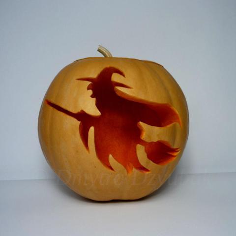 Witch wearing a black waving cloak and a pointed hat, flying on a broomstick is depicted on a carved pumpkin.