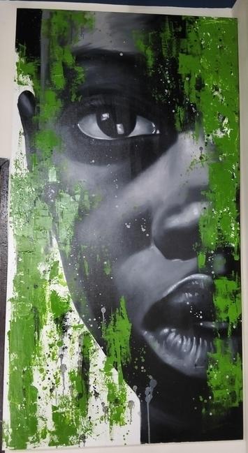 a painting of a young african persons face, a close-up of half of it against a white background, green paint splattered in strips around it, the face has a calm expression 