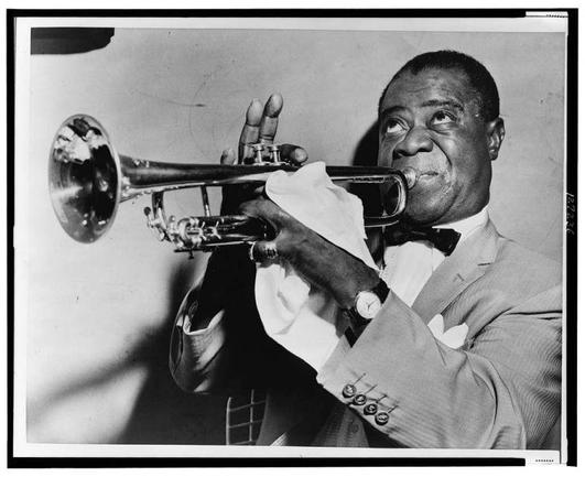 Louis Armstrong playing his trumpet