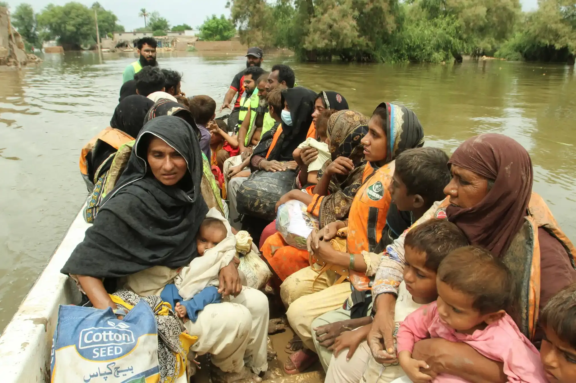 Women & children in a rescue boat, Chenab River.