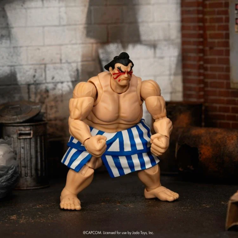 the figure flexing its arms, a different head on it, his mouth closed and angry looking 