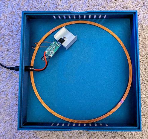 Housing containing an induction coil and associated circuitry 