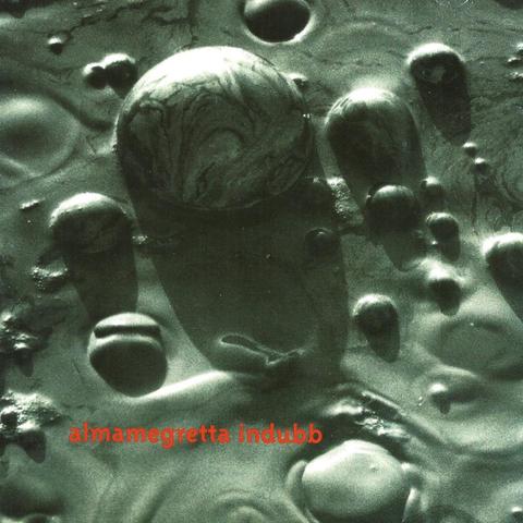 Album cover of Almamegretta – Indubb (1996). A minimalistic design with earthy tones and abstract shapes, reflecting the warm, atmospheric and dub-infused mood of the album.