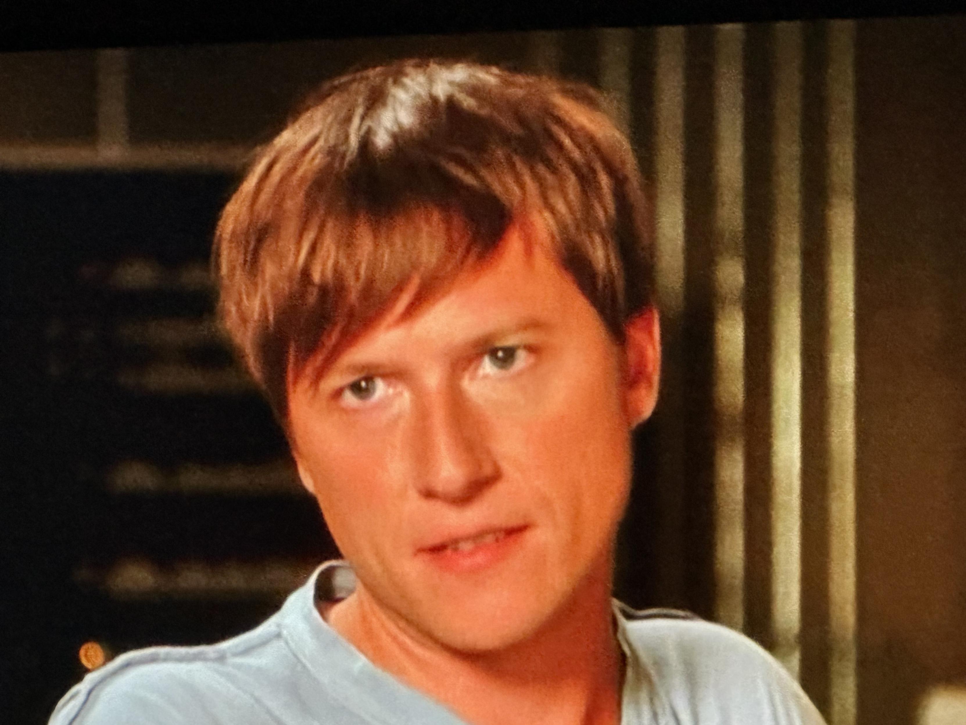 Quinn styling a mop-top hair cut similar to something like what kids in the 60’s wore.