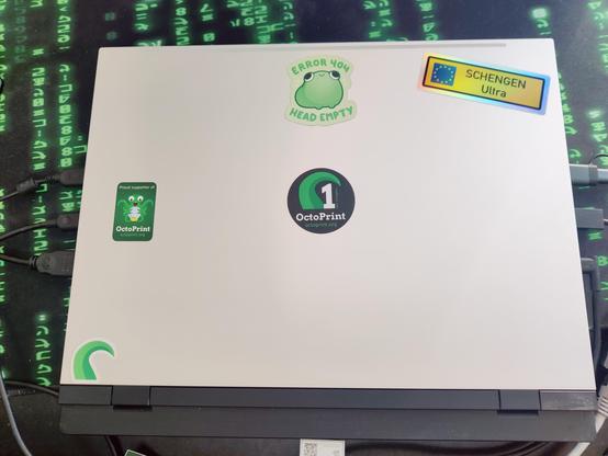 Photo of my Framework 16. The Framework Logo is stickered over with a 1 year support octoprint sticker