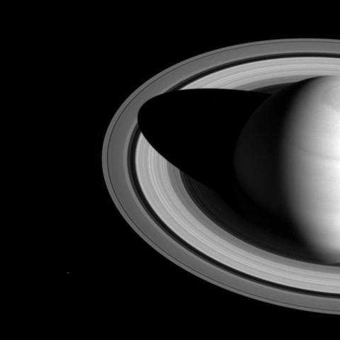 The shadow of Saturn on the rings, which stretched across all of the rings earlier in Cassini's mission (see PIA08362), now barely makes it past the Cassini division.
The changing length of the shadow marks the passing of the seasons on Saturn. As the planet nears its northern-hemisphere solstice in May 2017, the shadow will get even shorter. At solstice, the shadow's edge will be about 28,000 miles (45,000 kilometers) from the planet's surface, barely making it past the middle of the B ring.
The moon Mimas is a few pixels wide, near the lower left in this image.
This view looks toward the sunlit side of the rings from about 35 degrees above the ring plane. The image was taken in visible light with the Cassini spacecraft wide-angle camera on May 21, 2016.
The view was obtained at a distance of approximately 2.0 million miles (3.2 million kilometers) from Saturn. Image scale is 120 miles (190 kilometers) per pixel.
