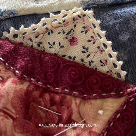 Embellished triangle of fabric. 