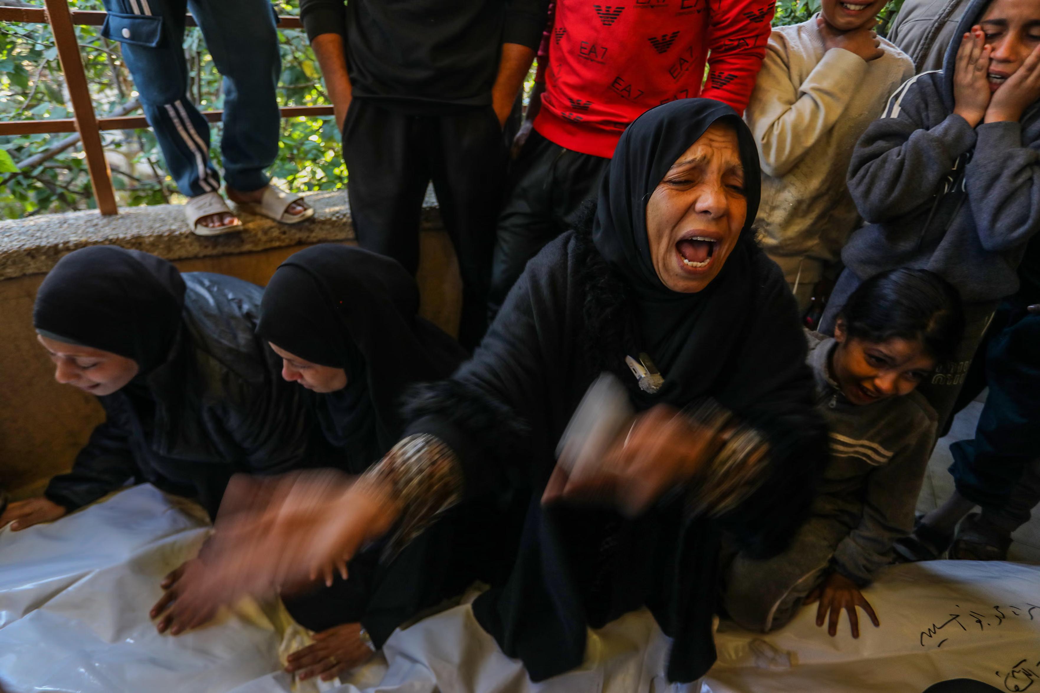 Relatives mourn the loss of six Palestinians.