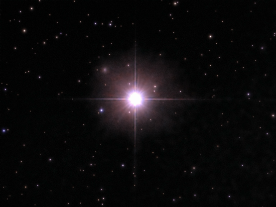 The star Mirach- telescope processed image. Mirach (beta Andromedae) is an immense, aging red giant star in the Andromeda constellation, about 197 light-years away.