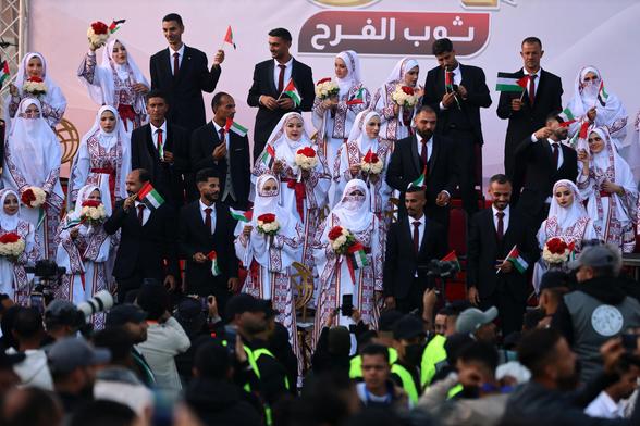 The brides and grooms at a mass wedding in Gaza.