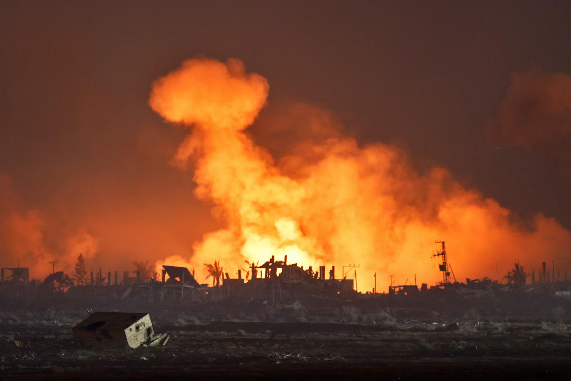 An explosion in Gaza is seen from the Israeli side of the Israel-Gaza border, July 24.