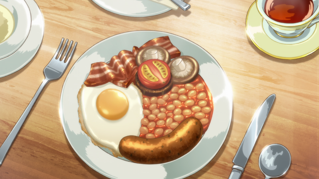 A plate on a table with a sunny side up egg, slice of bacon, half a tomato, two mushrooms, beans, and a sausage, with a cup of tea elsewhere on the table.
