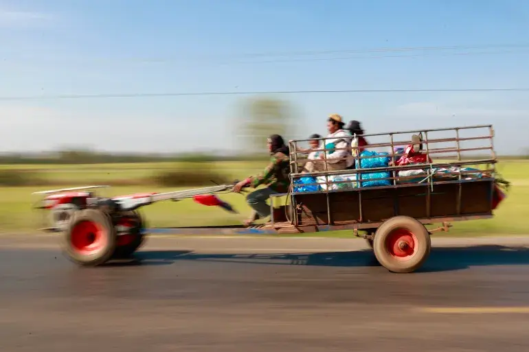 Family flees in a trailer.