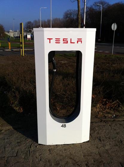 White charging dispenser, with TESLA in red letters