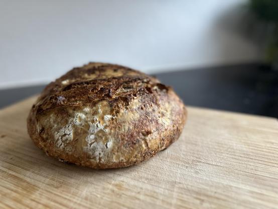 Sourdough bread on a wooden plank.