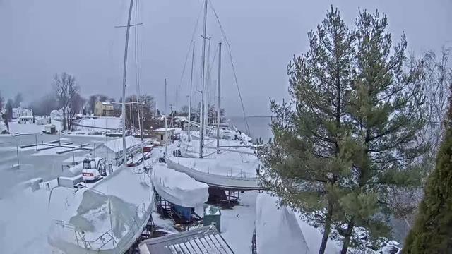 View looking west from the office of Navy Point Marine with the shore of Lake Ontario in the distance. // Image captured at: 2025-12-10 21:30:14 UTC (about 1 min. prior to this post) // Current Temp in Sackets Harbor: 34.44 F | 1.36 C // Precip: snow // Wind: N at 6.912 mph | 11.12 kph // Humidity: 94%