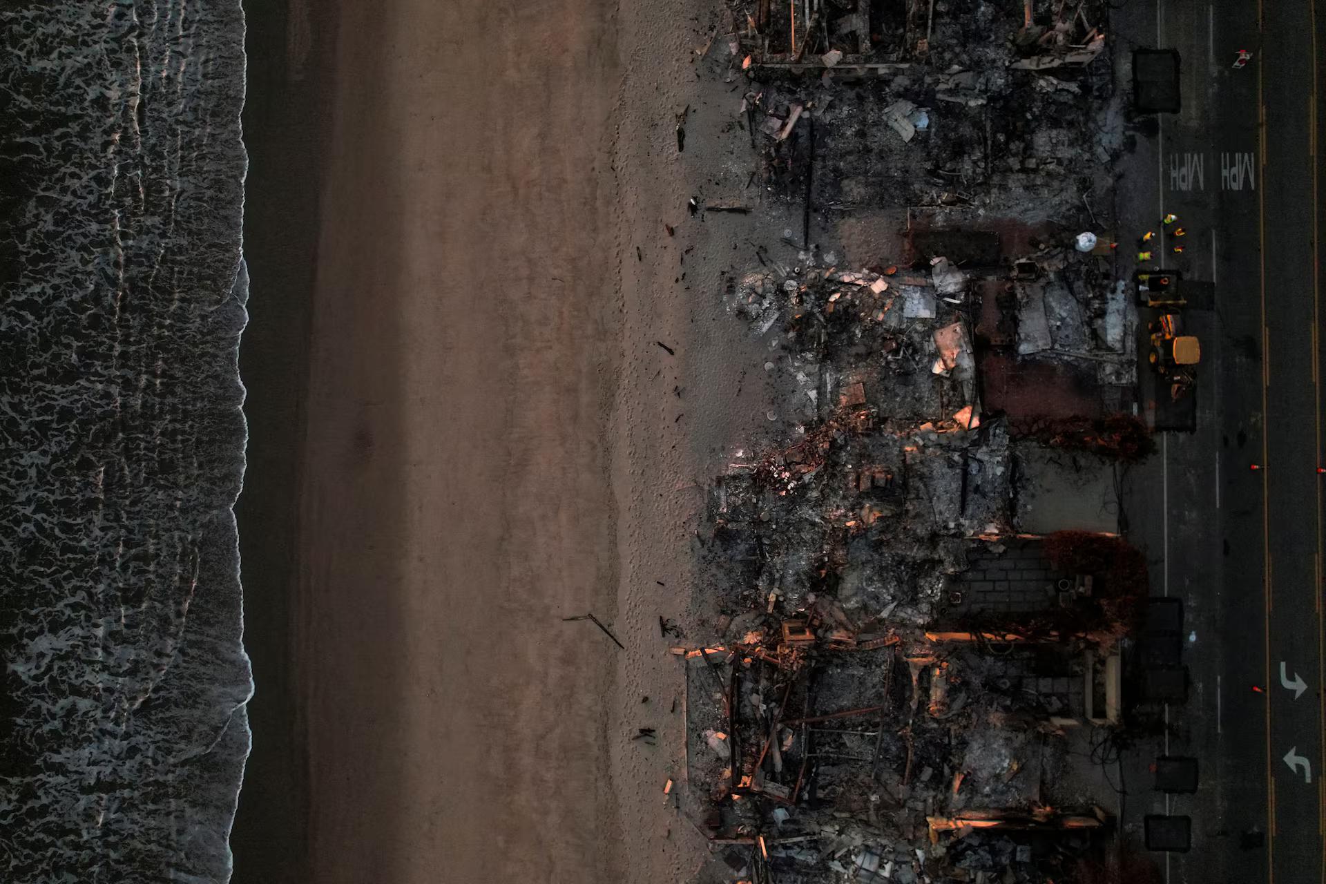 A drone view of buildings destroyed during the Palisades Fire in Malibu on the beachfront.
