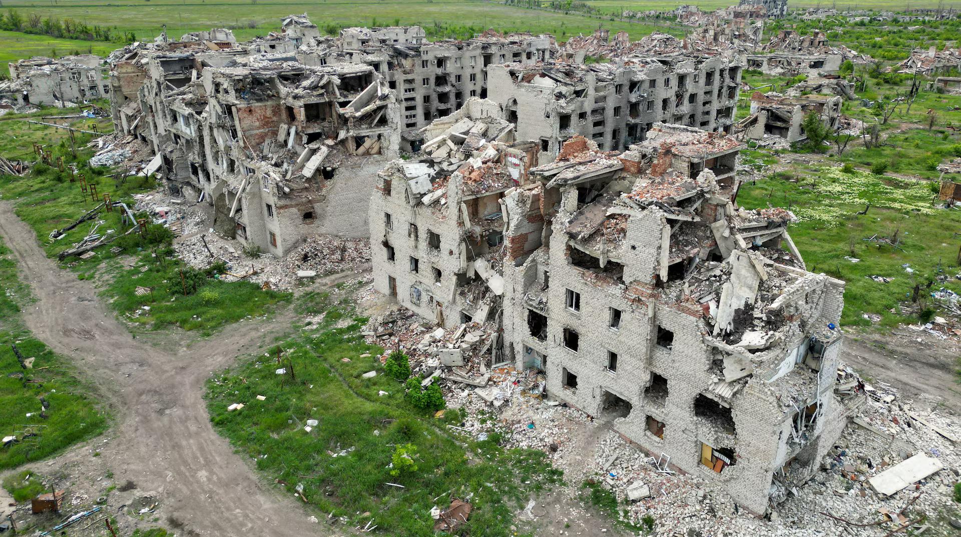 A drone view shows the ruins of residential buildings in the abandoned town of Marinka, in the Donetsk region.