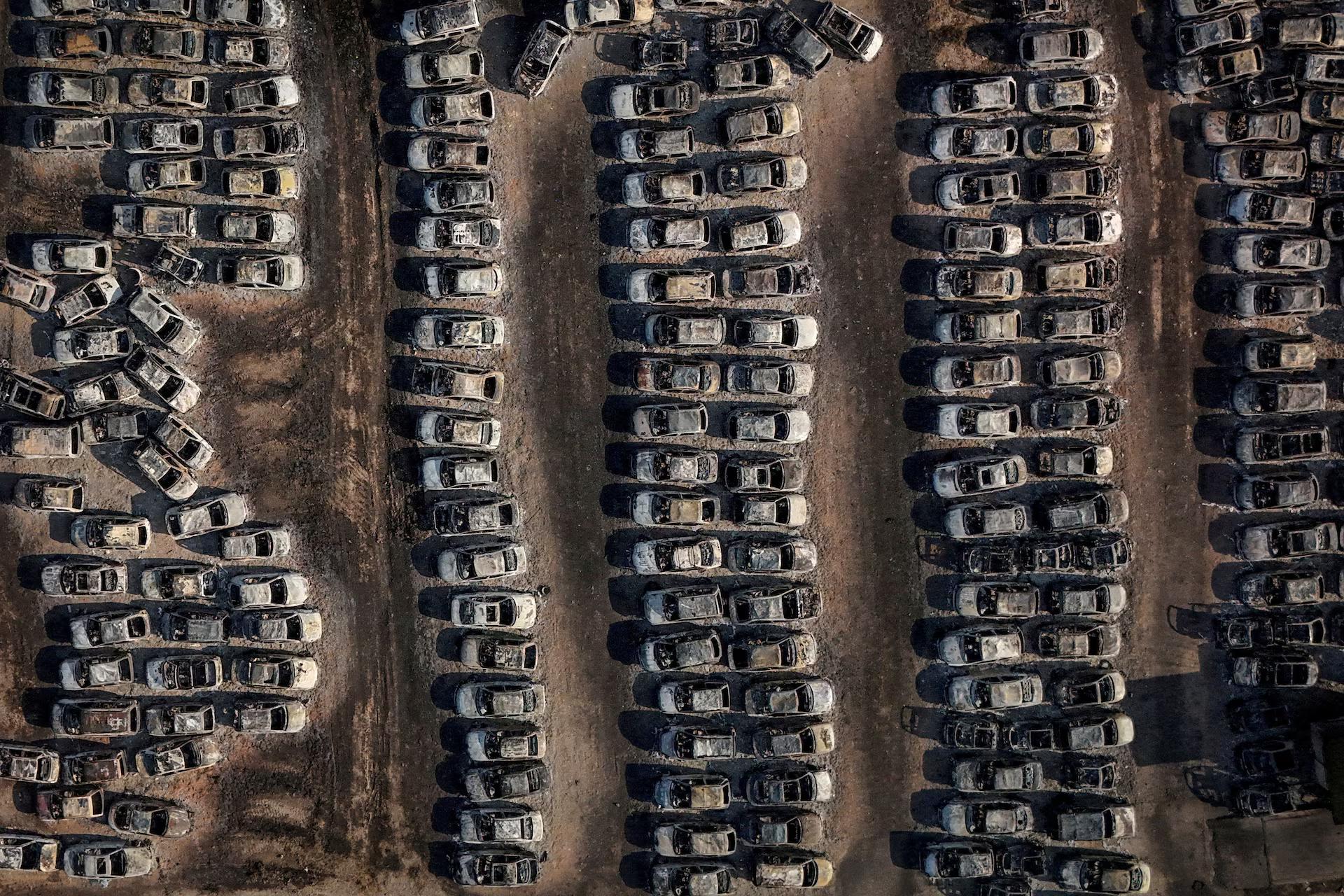 A drone view shows burnt cars following a wildfire in Dymi.