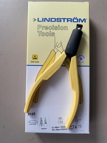 Pliers on top of the box.