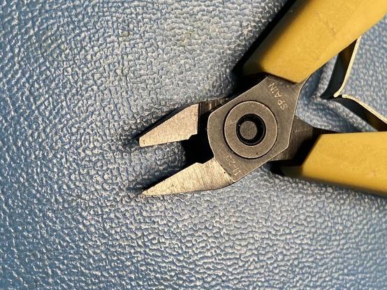 Pliers with snapped tip.