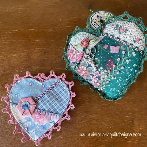 Two small crazy quilt hearts - one blue & pink; second green & rose. 