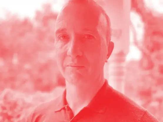 Red and white duotone image of Thomas Weaver