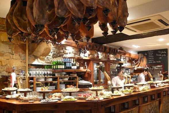 small bites: photograph of a Spanish bar with plates of tapas. Photo attributions: Flickr user kudo88