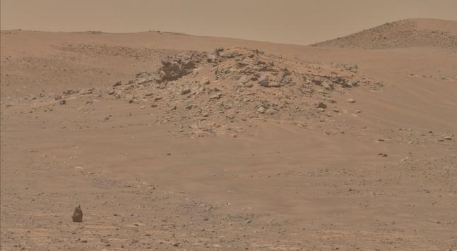 An ochre toned image capturing a Martian landscape.