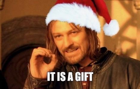 Boromir (Sean Bean) from Lord of the Rings as the "It is a gift" meme, only he is now wearing a red and white Santa hat.