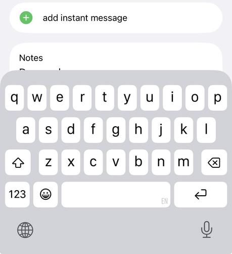 Screenshot of an iPhone as a user edits the Notes field in the Contacts app. The actual text entry area is almost completely obscured by the keyboard interface, so as one types one cannot see what one is typing. 