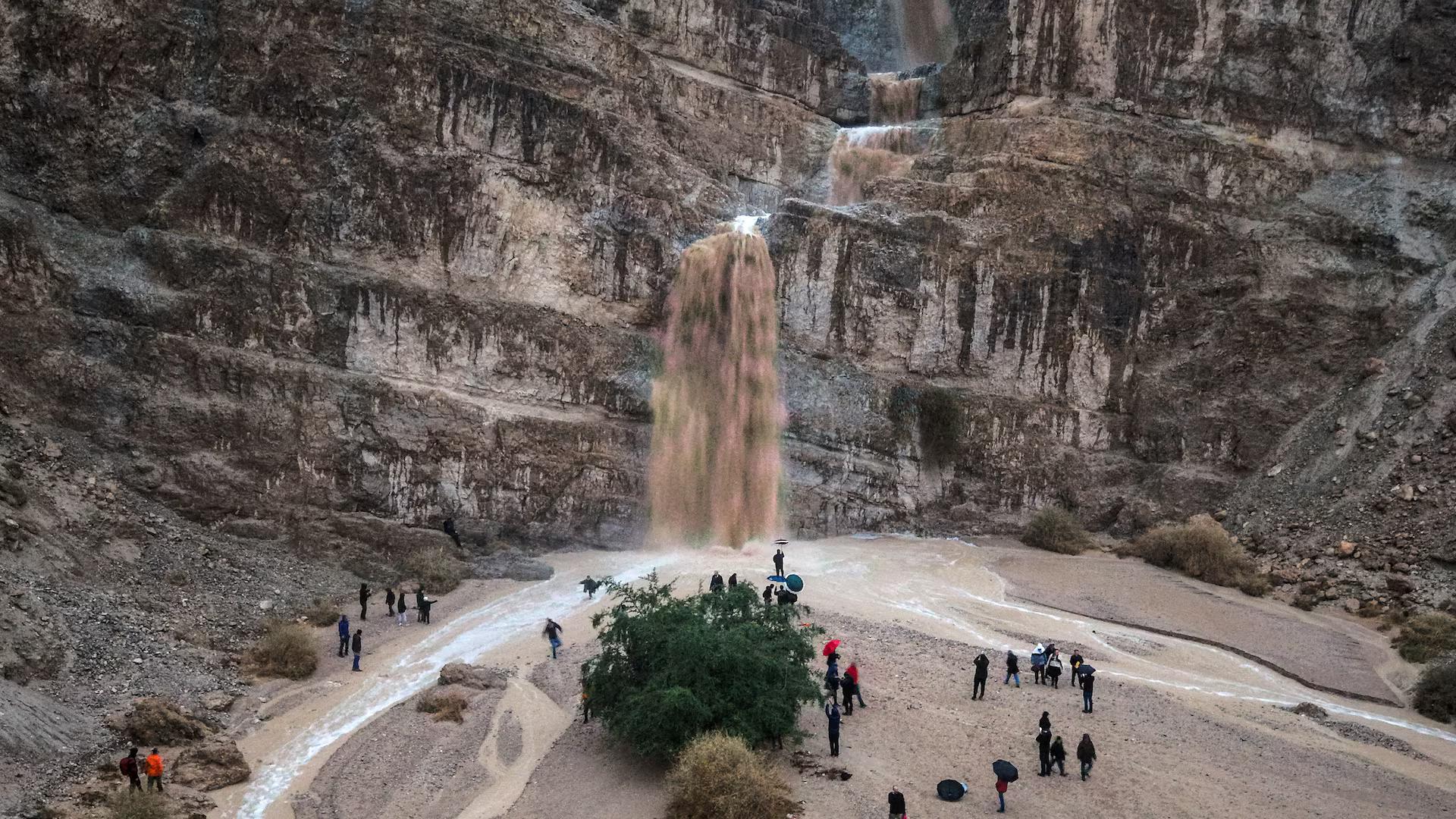 A drone view shows rainfall creating new waterfalls during Storm Byron in Qumran.