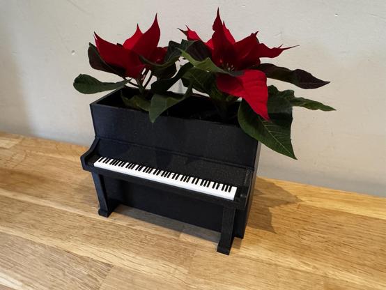 Teeny tiny piano with flowers in it