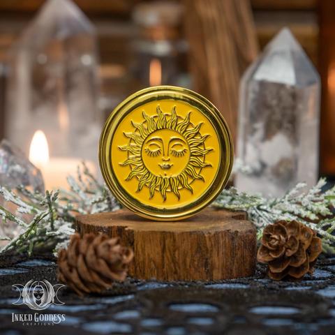 A photo of the exclusive "Sun & Moon Gold Coin" product from Inked Goddess Creations.