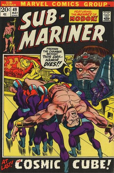 Sub-Mariner #49 cover. Namor is restrained by robots as MODOK stands behind machinery. He says, "Prepare the chamber! This may--Namor dies!!" On page bottom, "At Last! The Cosmic Cube!."
