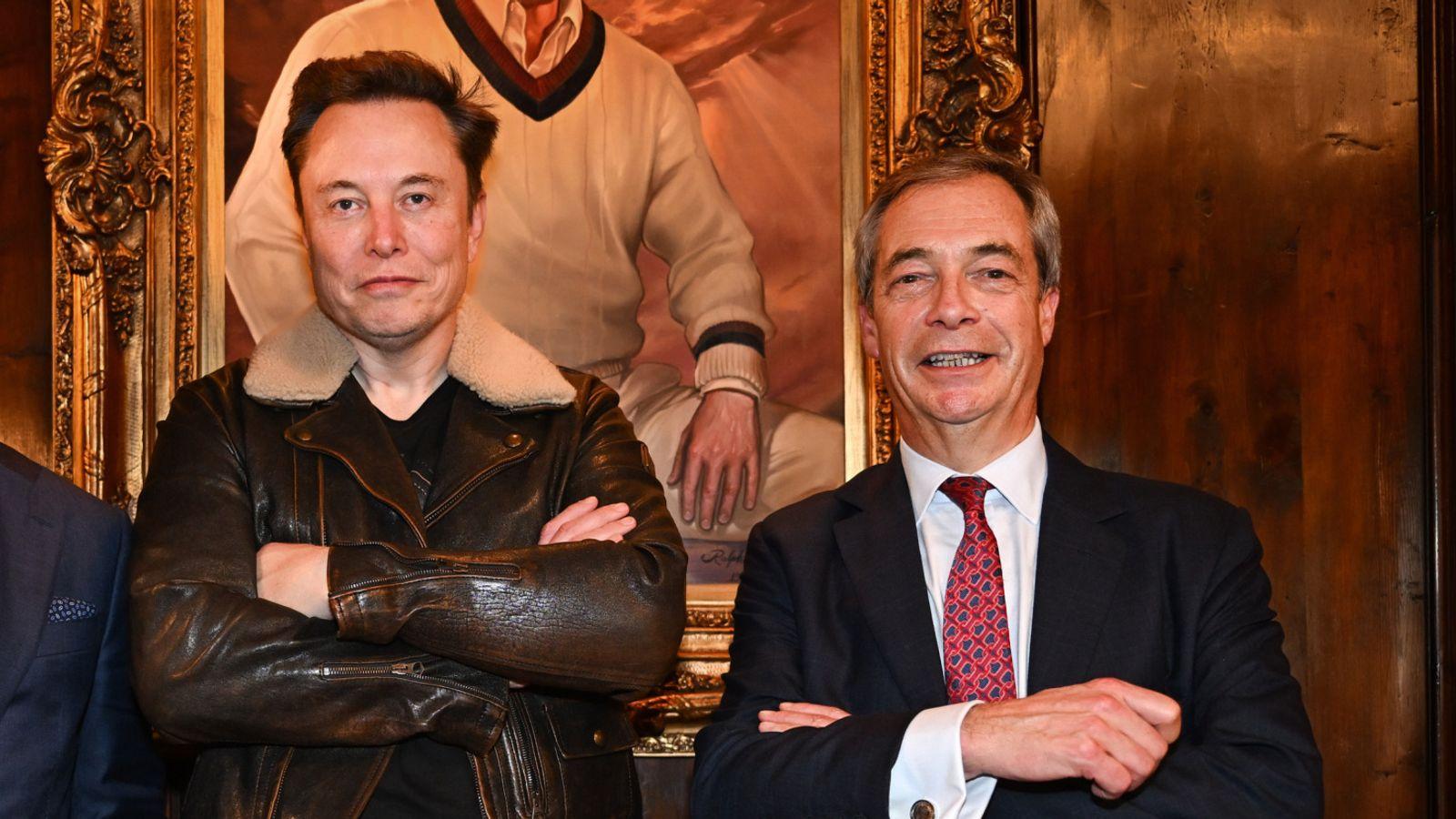 Photo of two shaved apes girning for the camera, standing in front of a painting showing a tiny-handed vulgarian.