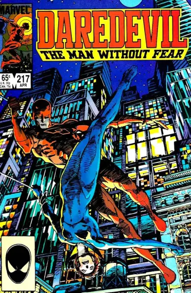 a cover of a comic book, it is daredevil , the title is at the top center in straight red lettering on a golden rectangle, daredevil is swinging though, the black widow doing a flip in front of him , tall buildings around them