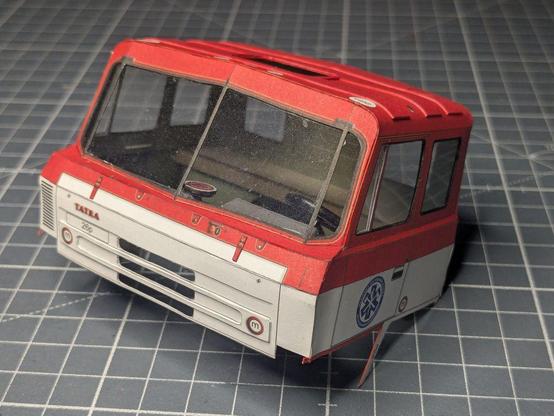 The cab with the back seat cushion inserted.