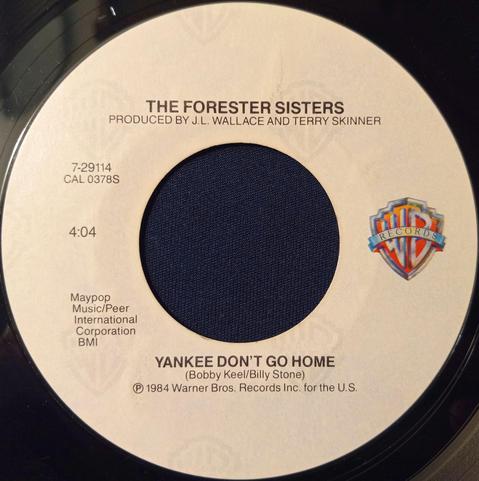 An image of the 45 RPM vinyl record of "Yankee Don’t Go Home", the B-Side to the hit single, "(That’s What You Do) When You’re in Love", by The Forester Sisters on Warner Brothers Records released in late 1984 from their (at that time) forthcoming self-titled debut Album. 