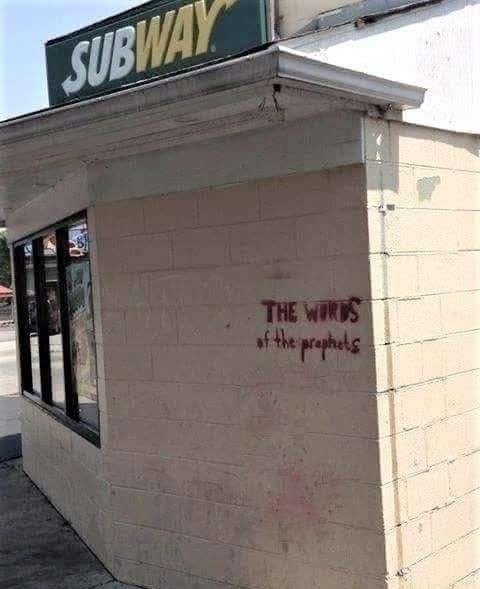"The Words Of The Prophets" spray painted on a wall of a subway sub shop.