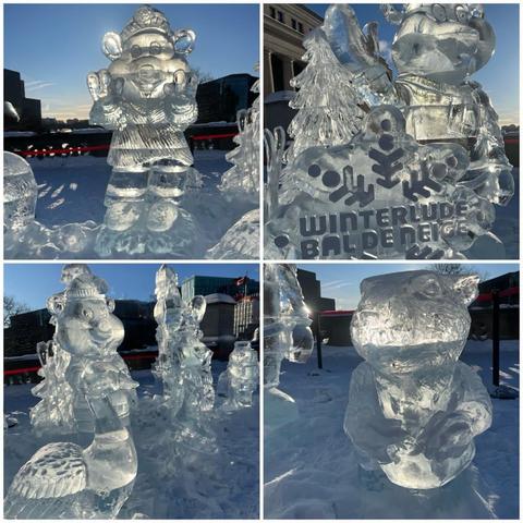 Grid of four photos of ice sculptures on the Plaza Bridge over the Rideau Canal in Ottawa.
1) A cute animal (bear?) wearing a tuque and sweater waving.
2) A stylized snowflake with the words Interlude Bal de Neige on it, a ice tree and another waving animal behind.
3) Wider shot showing a Goose, some bears, and in the distance, the National Arts Centre with a Canadian flag blowing in the wind on the far right of the frame.
4) Closeup of an unimpressed-looking beaver.