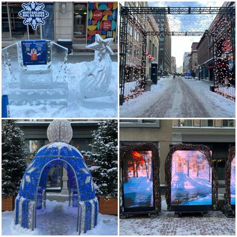 Grid of four photos, all taken on Sparks Street in Ottawa:
1) A Winterlude / Bal De Neige marker made from ice, with two stars on the right.
2) A metal girder structure over the street, with lights that continuously change colours strung from them.
3) a four metre tall blue and silver toque-like structure with lights framed with two conifers.
4) three large screen vertically mounted TVs showing a fall/winter scene (trees with orange and red leaves, snow on the ground, and a flowing river).