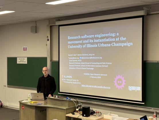 A white man in front of slides