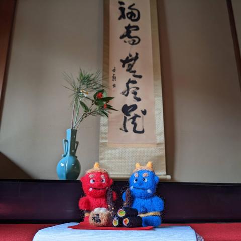 Tiny felt red and blue oni with lucky beans and makizushi.